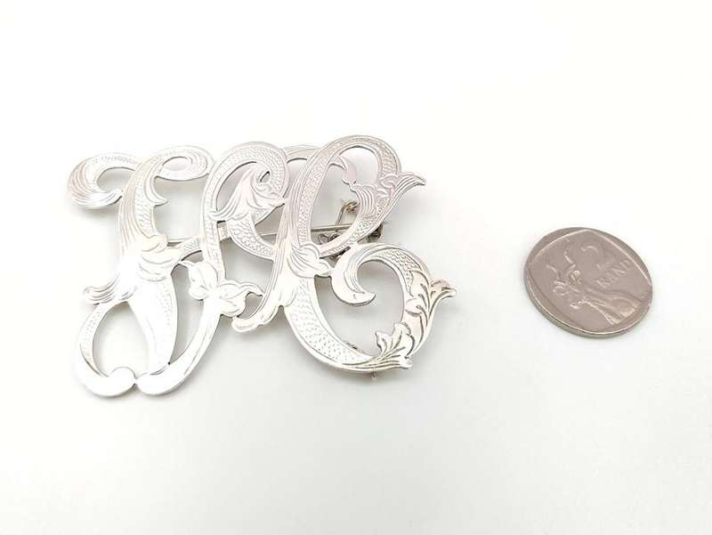 Gorgeous sterling silver scrolled initials brooch