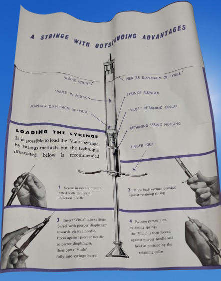 Boots viule syringe in a metal case with two glass containers with needles inside.