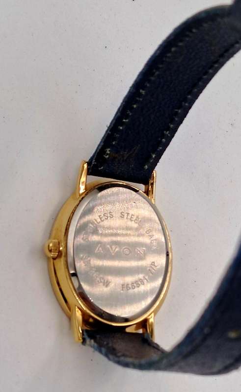 Pre-Owned Ladies AVON Quartz Watch -Working -missing a few decorative stones on the face