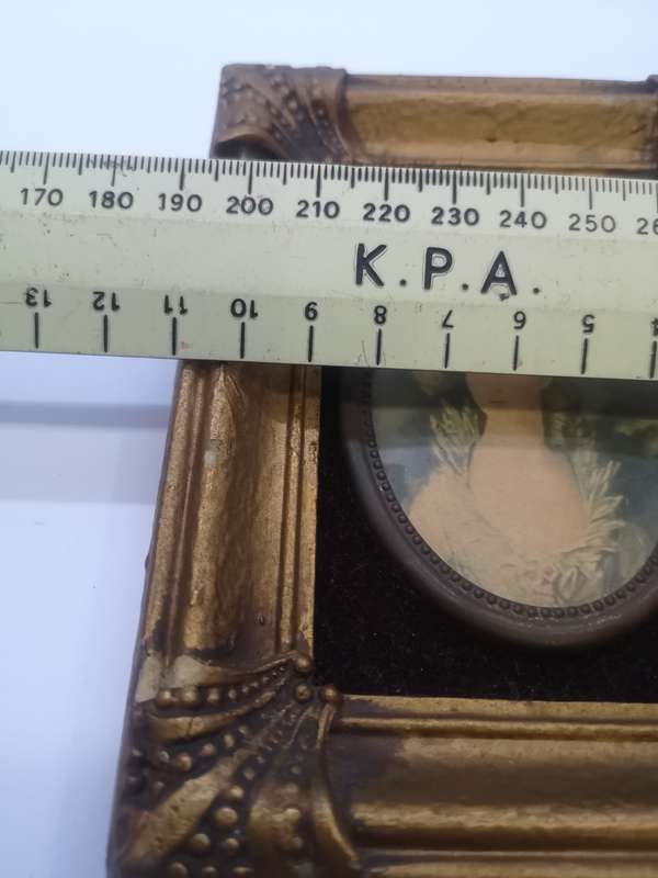 Small ornate frame with picture