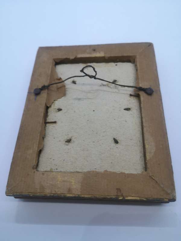 Small ornate frame with picture