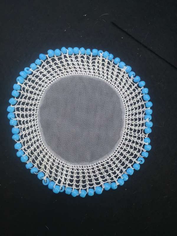 Blue glass bead doilie