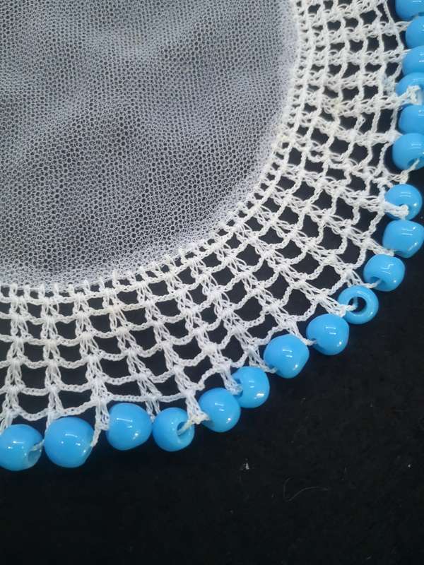 Blue glass bead doilie