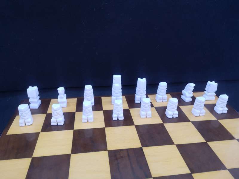 Black and yellow wood chess board with chess set