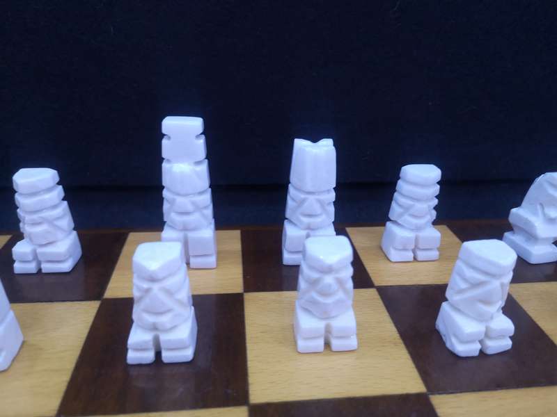 Black and yellow wood chess board with chess set