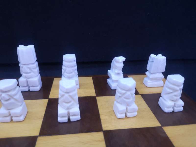 Black and yellow wood chess board with chess set