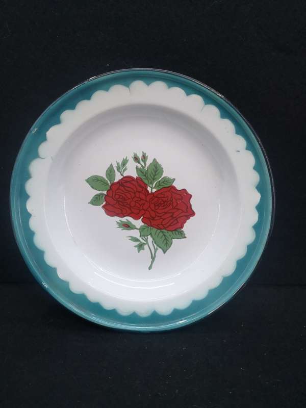 Old enamel plate with rose detail