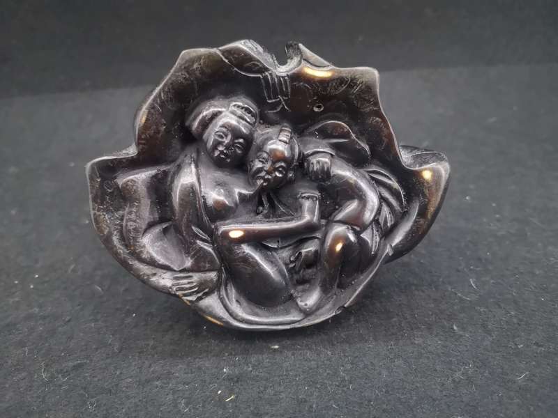 Buddha with Kama Sutra scene at the bottom