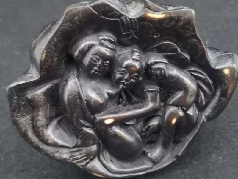 Buddha with Kama Sutra scene at the bottom