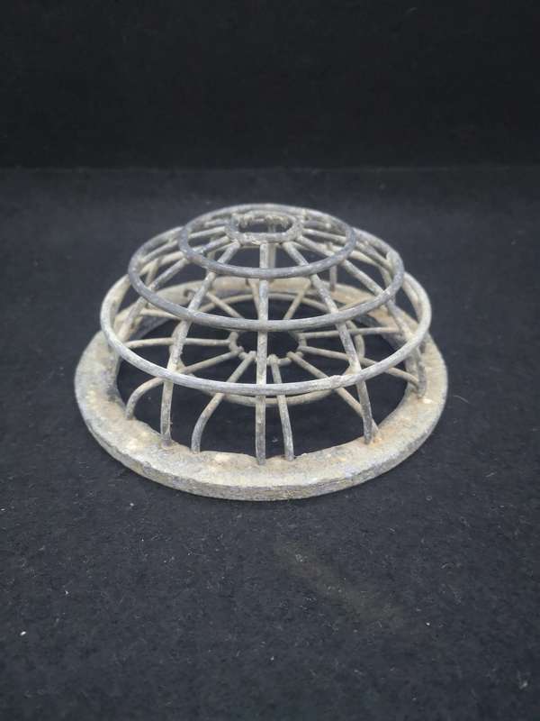 Vintage drain cover/flower frog?