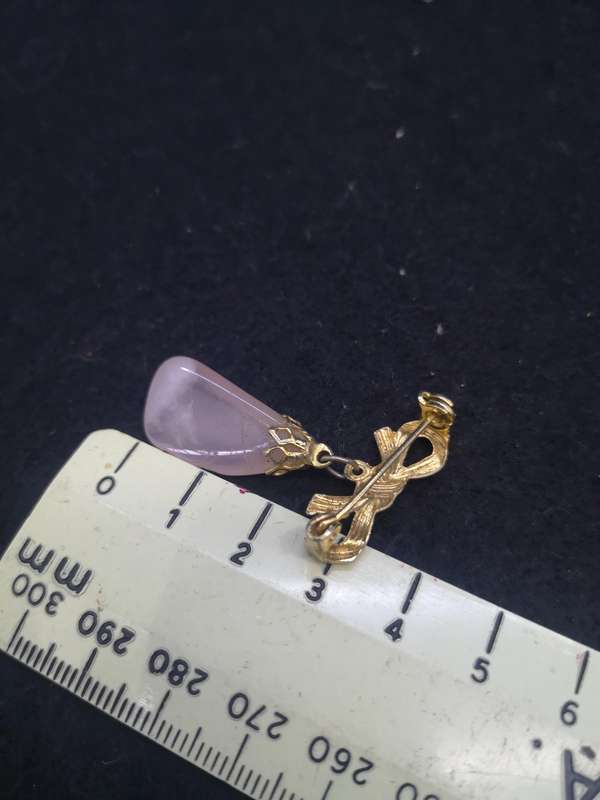 Pink stone brooch