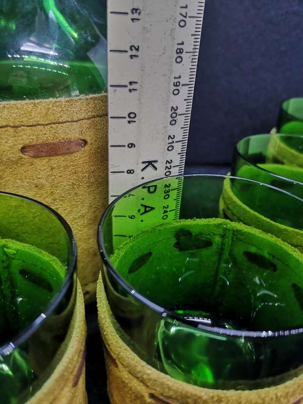 Green glass bottle decanter and set of 6 glasses encased in leather