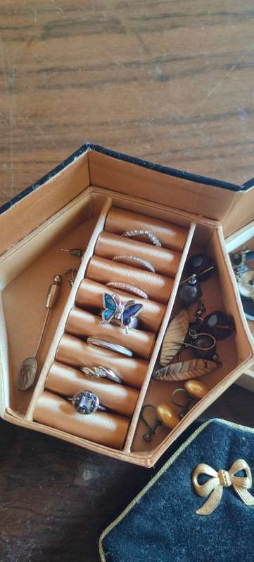 Lot of costume jewelry in octagonal jewelry box