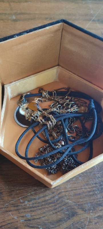 Lot of costume jewelry in octagonal jewelry box
