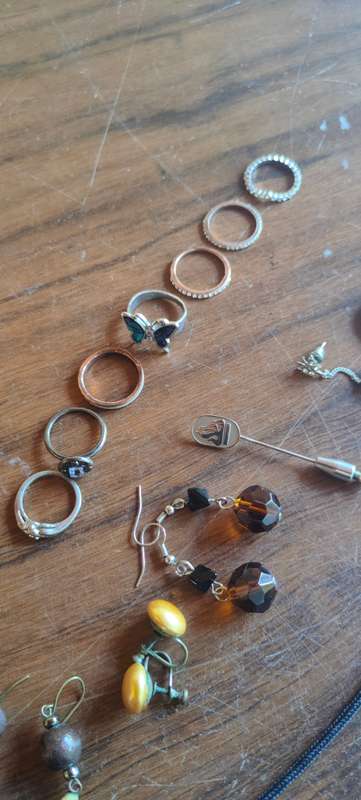 Lot of costume jewelry in octagonal jewelry box