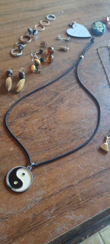 Lot of costume jewelry in octagonal jewelry box