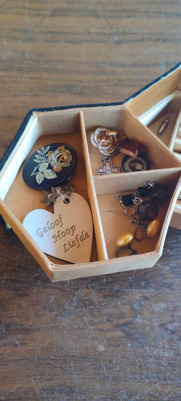 Lot of costume jewelry in octagonal jewelry box