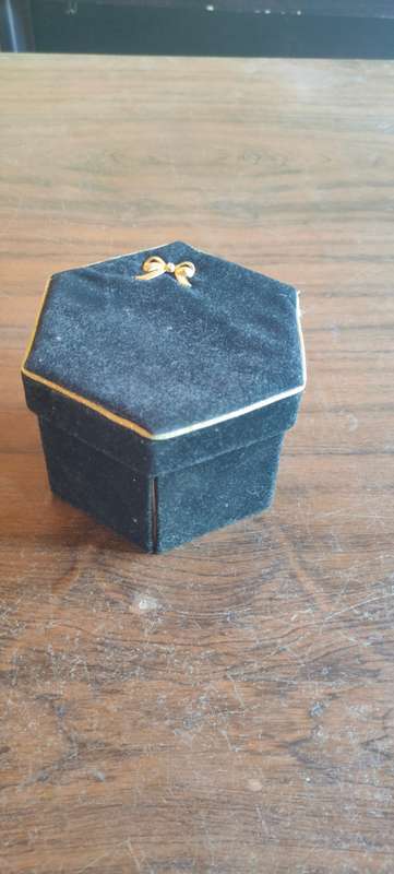 Lot of costume jewelry in octagonal jewelry box