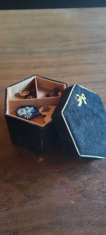 Lot of costume jewelry in octagonal jewelry box