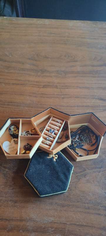 Lot of costume jewelry in octagonal jewelry box