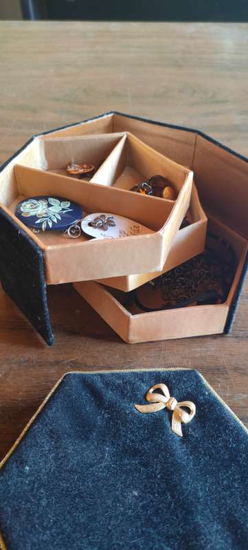 Lot of costume jewelry in octagonal jewelry box