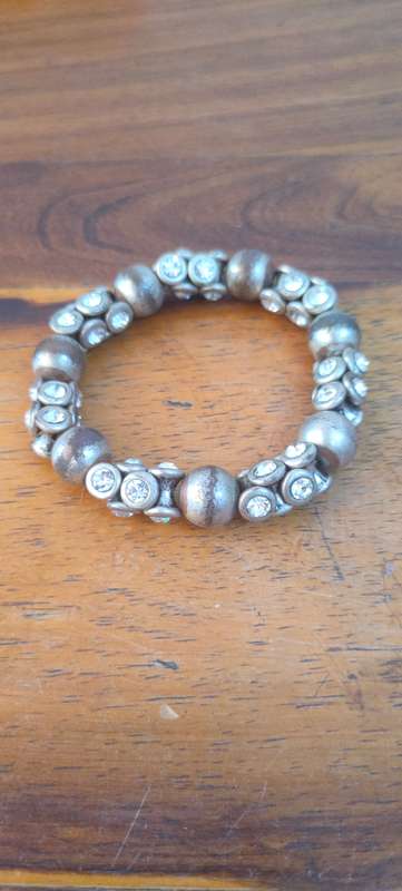 Stretch bracelet with silver colored beads