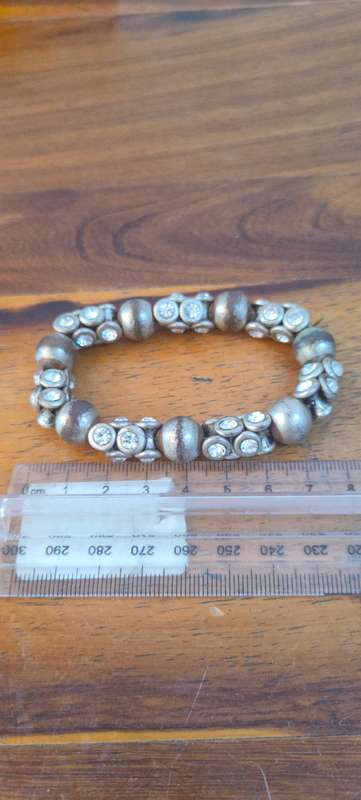Stretch bracelet with silver colored beads