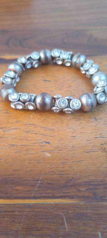 Stretch bracelet with silver colored beads