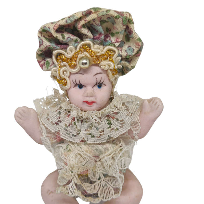 Vintage small baby/jester porcelain doll