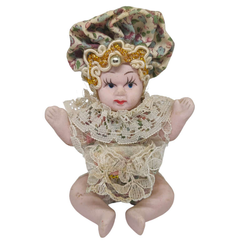 Vintage small baby/jester porcelain doll