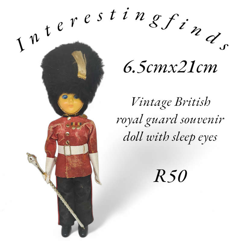 Vintage British royal guard souvenir doll with sleep eyes