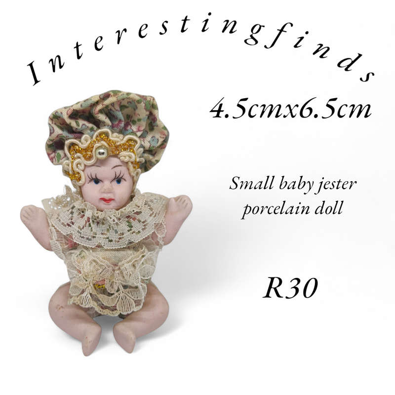 Vintage small baby/jester porcelain doll
