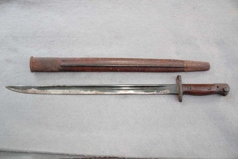 Bayonet dated 1907 (WW1?) with excellent scabbard. Reason for low price below.......
