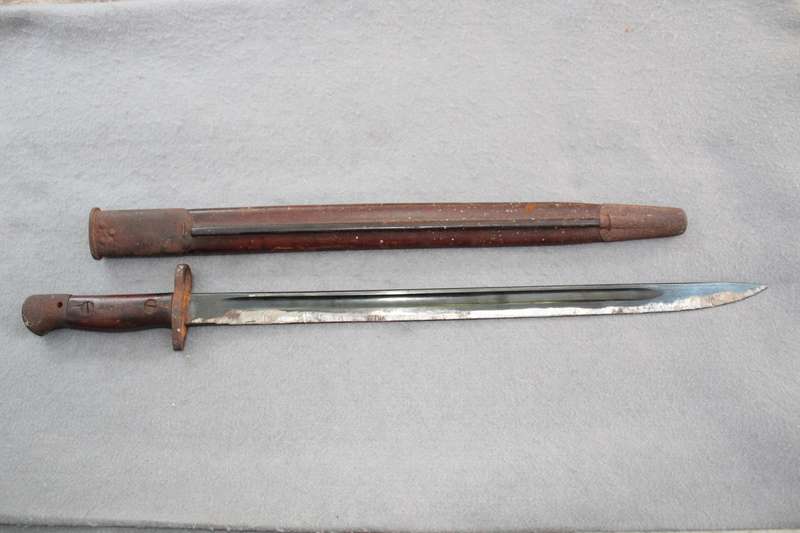 Bayonet dated 1907 (WW1?) with excellent scabbard. Reason for low price below.......
