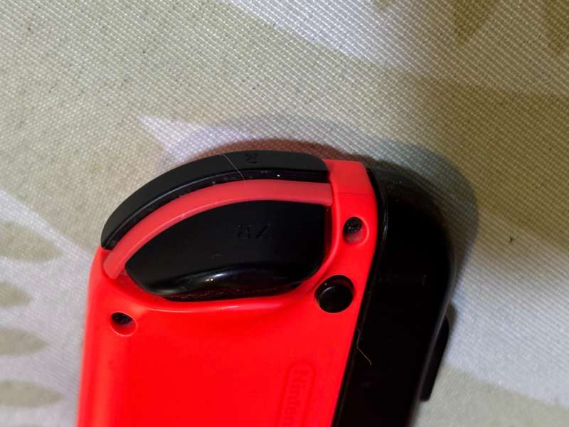 neon red right Joy-Con controller for Nintendo Switch with strap
