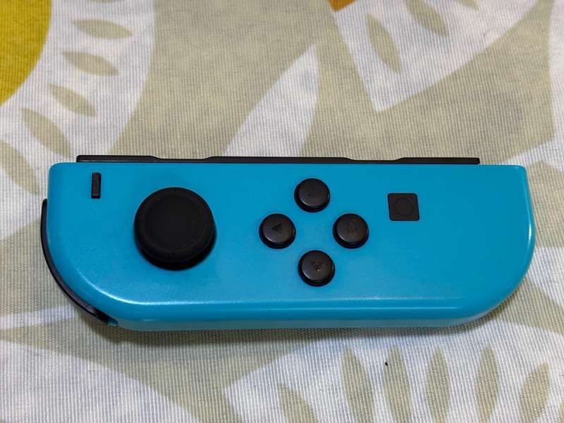 neon blue Left Joy-Con controller for Nintendo Switch + wrist strap