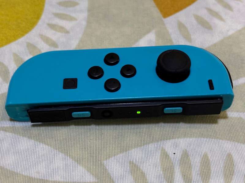 neon blue Left Joy-Con controller for Nintendo Switch + wrist strap