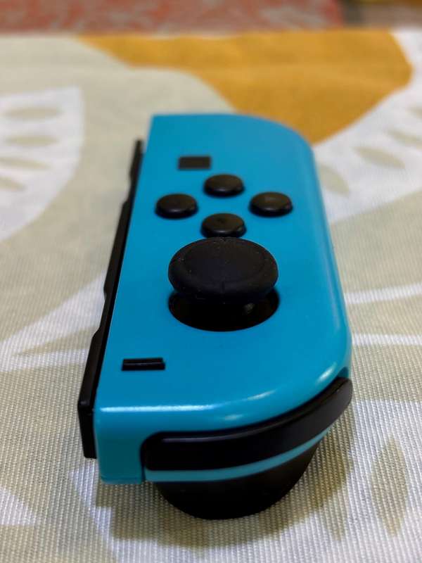 neon blue Left Joy-Con controller for Nintendo Switch + wrist strap
