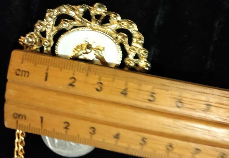 Necklace - Cameo Pendant gold tone on white metal embossed gold tone Lobster clasp metal chain