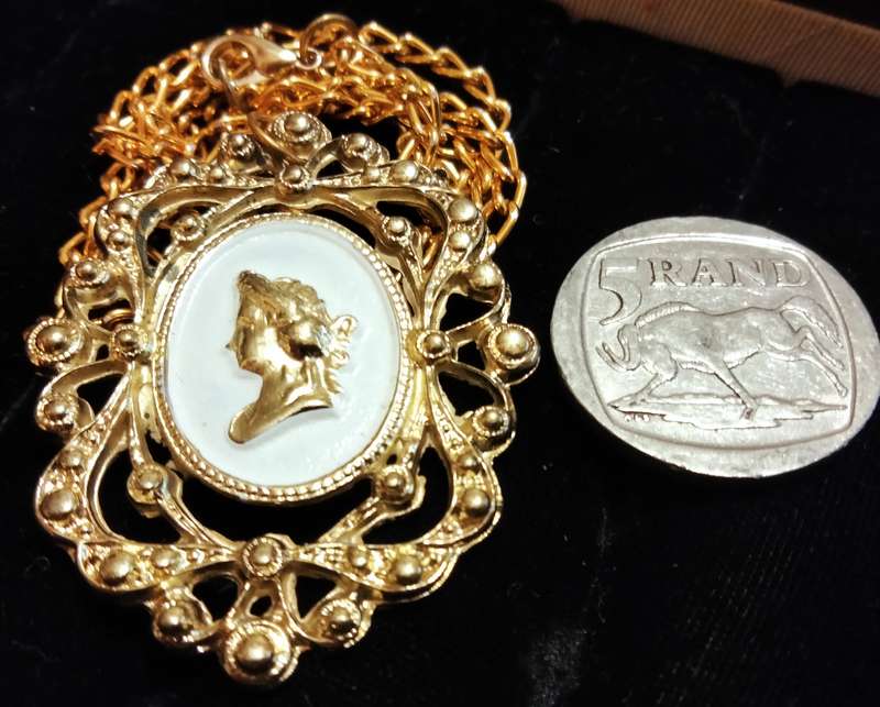 Necklace - Cameo Pendant gold tone on white metal embossed gold tone Lobster clasp metal chain