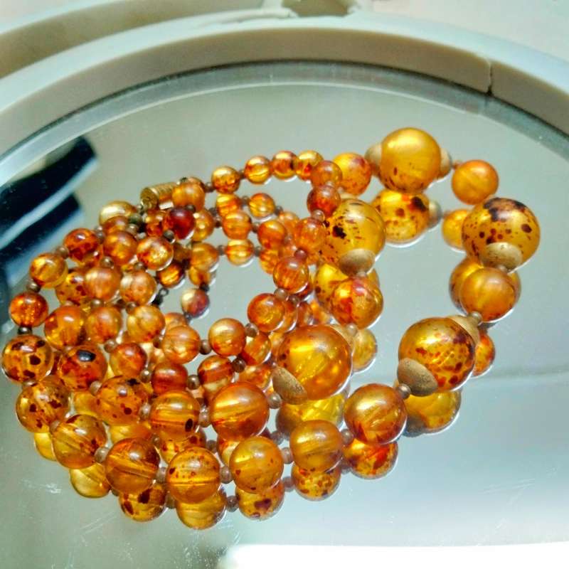 Necklace  AMBER graduating faux round beads+ small beads gold tone metal spacers + barrel clasp