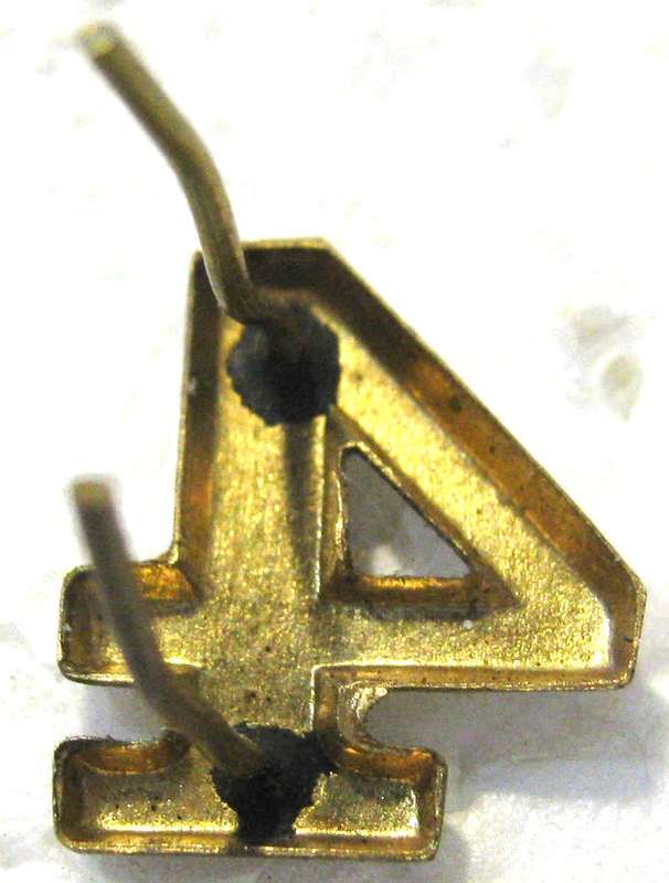WW2 FINLAND  "4" FOR A SHOULDER STRAP BADGE TO SHOW WHICH UNIT IT WAS FROM - WAS ABANDONED IN WW2