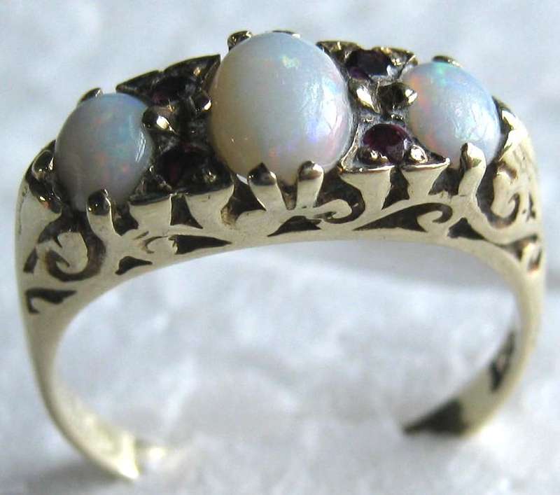 ANTIQUE 9CT YELLOW GOLD 3 STONE OPAL RING WITH 4 SMALL RUBIES 3 GRAMS TOTAL WEIGHT