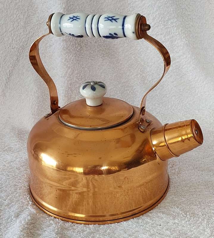 Copper kettle with nickel lining, whistle, porcelain handle and knob.