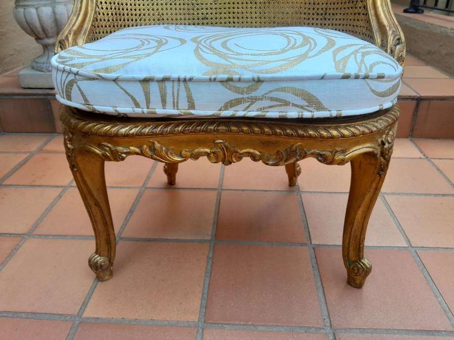 A 20th Century French Style Giltwood Rattan Chair Upholstered In Hand Printed Gold Design Fabric 