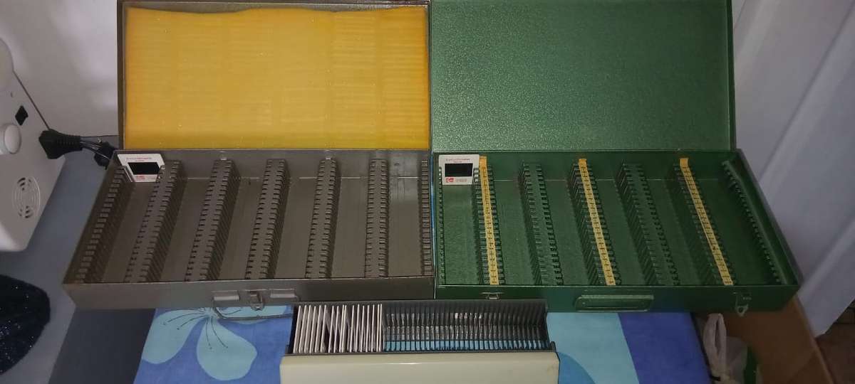 Small metal storage boxes for projectors slides, screws, nails, and small items