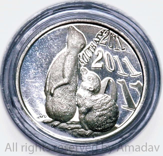 2011 COIN WORLD TOKEN IN COIN HOLDER