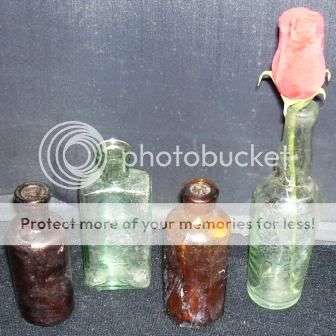 4 Small old Glass bottles