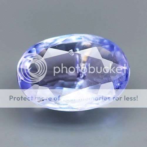 0.49ct - FLASHING Oval Violet Blue TANZANITE