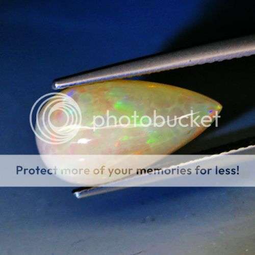WHAT A MAGNIFICENT OPAL THIS IS!  4.50CT.PEAR CABOCHON NATURAL GOLDEN RAINBOW COLOUR OPAL 100%